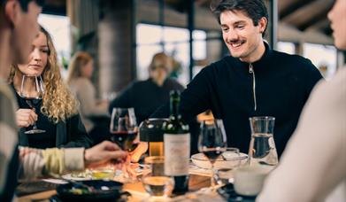 guests enjoying food and wine at restaurant Blikk Raw & Grill at Gaustablikk mountain resort